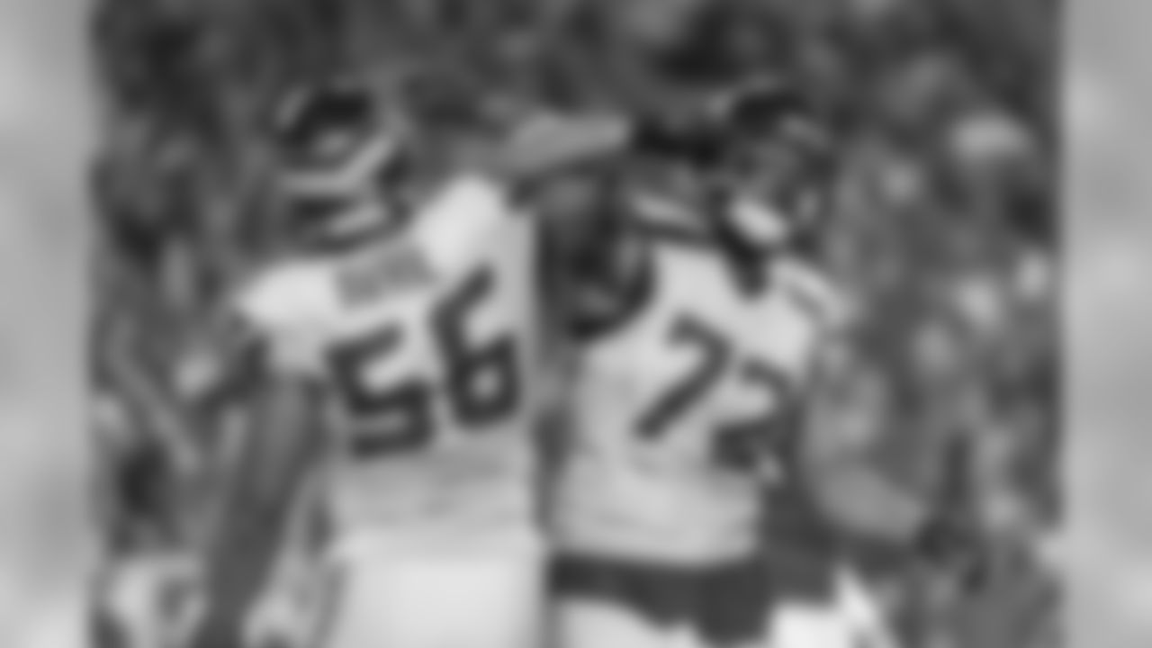 Seahawks Cliff Avril and Michael Bennett celebrate after another stop by the Seahawks defense.