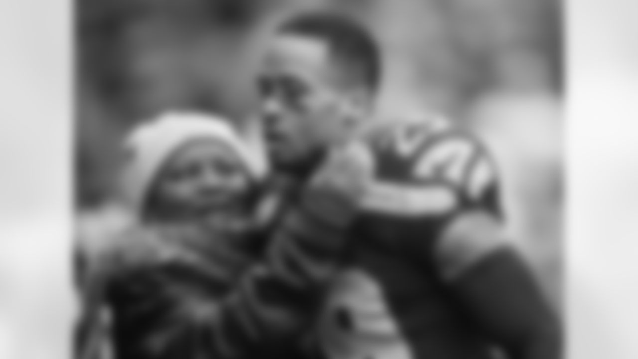 Debbie Thomas hugs her son, Seattle Seahawks free safety Earl Thomas before an NFL football game against the St. Louis Rams, Sunday, Dec. 29, 2013, in Seattle. (AP Photo/John Froschauer)