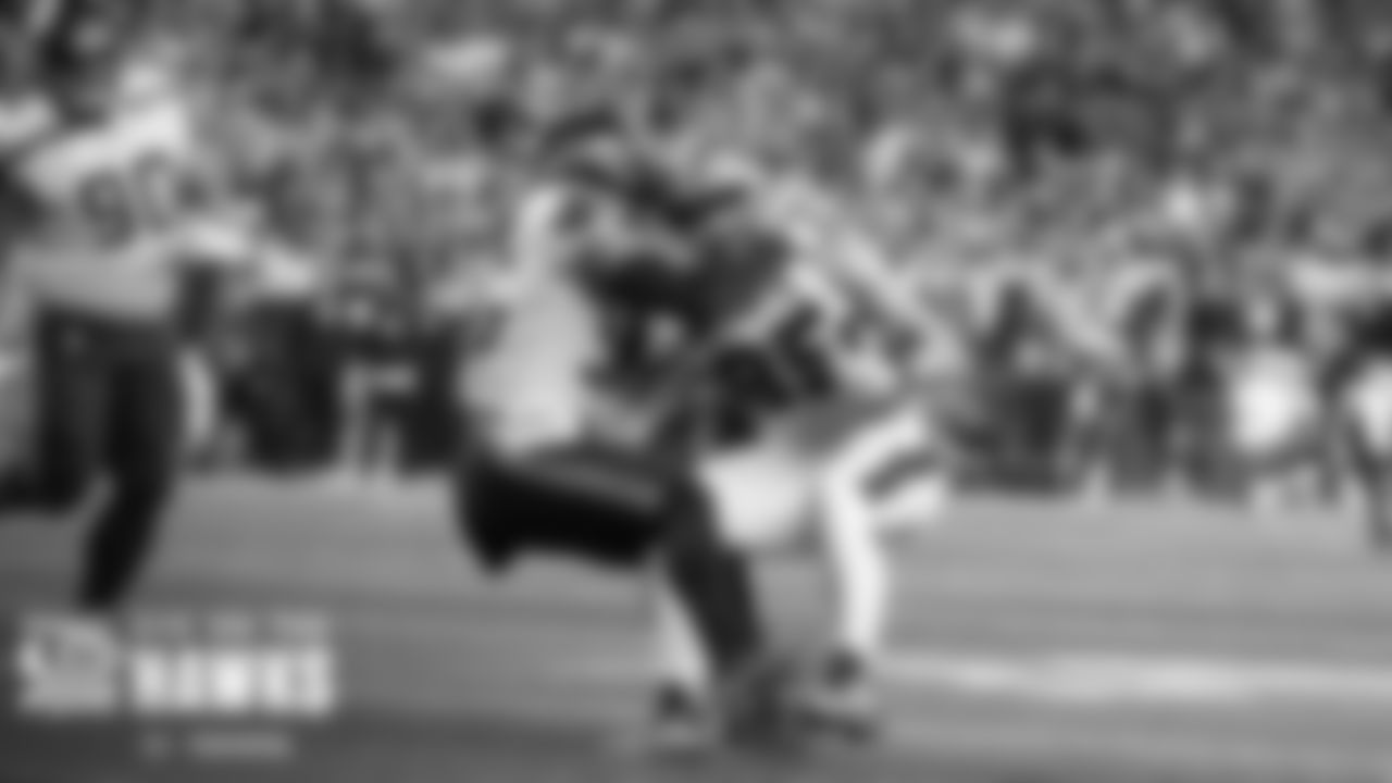 Seattle linebacker Jordyn Brooks brings down 49ers tight end George Kittle.