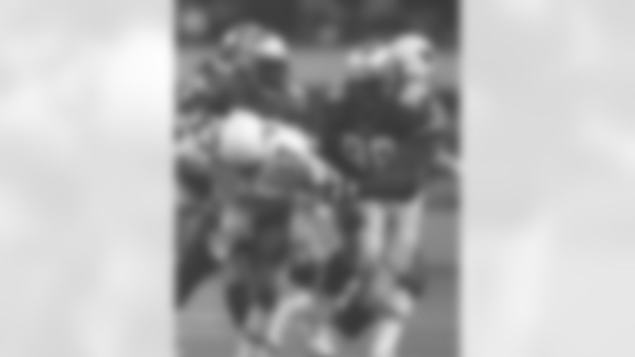 Adams, Sam & Daniels Phillip share a sack 99-211-15