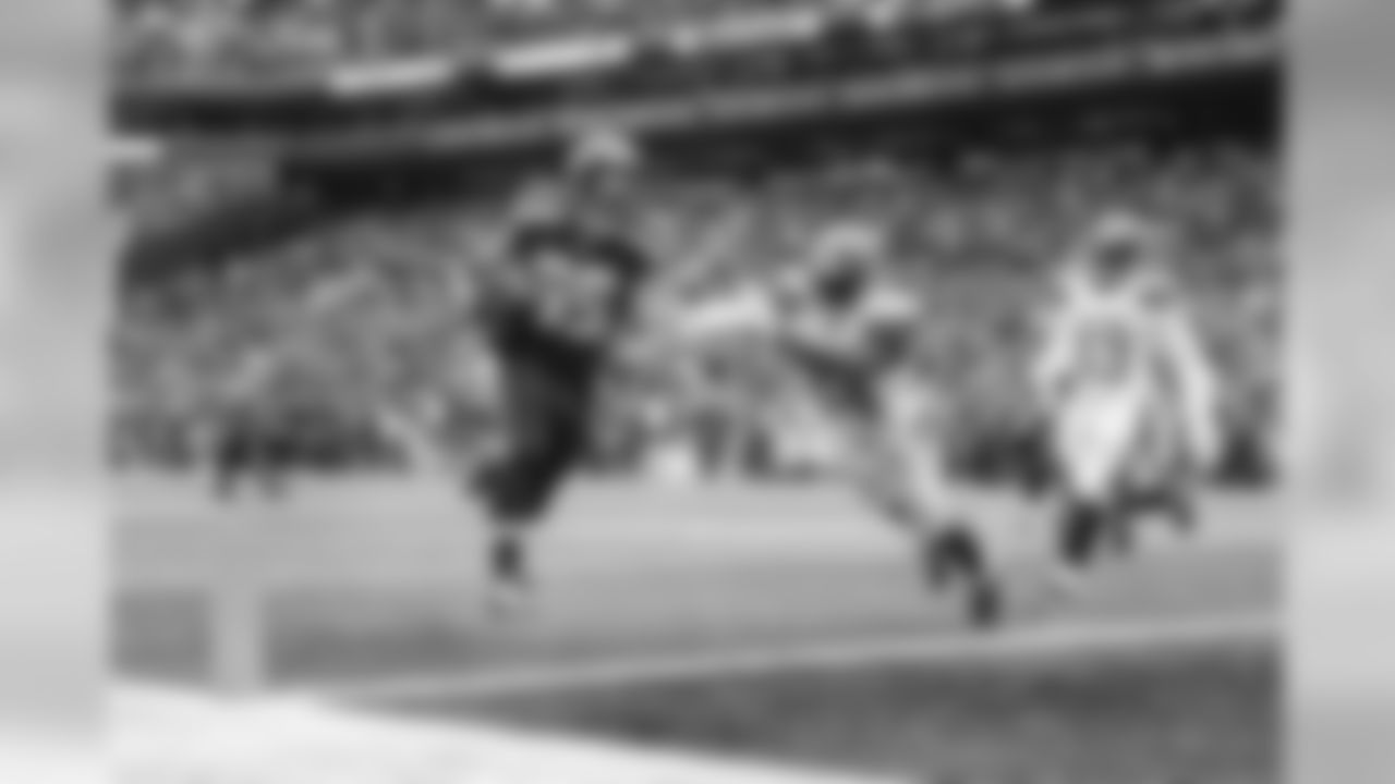 Seahawks receiver Doug Baldwin outraces Cleveland's Johnson Bademosi to the end zone for his second touchdown of the game and his tenth touchdown in four games.