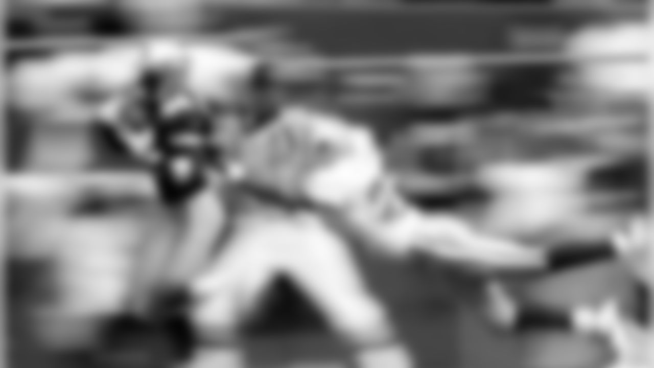 Seattle Seahawks receiver Joey Galloway (84) pulls in a 44-yard touchdown pass as Dallas Cowboys' Kevin Smith (26) defends on the play during the second quarter in Irving, Texas, Sunday, Nov. 22, 1998. (AP Photo/Bill Janscha)