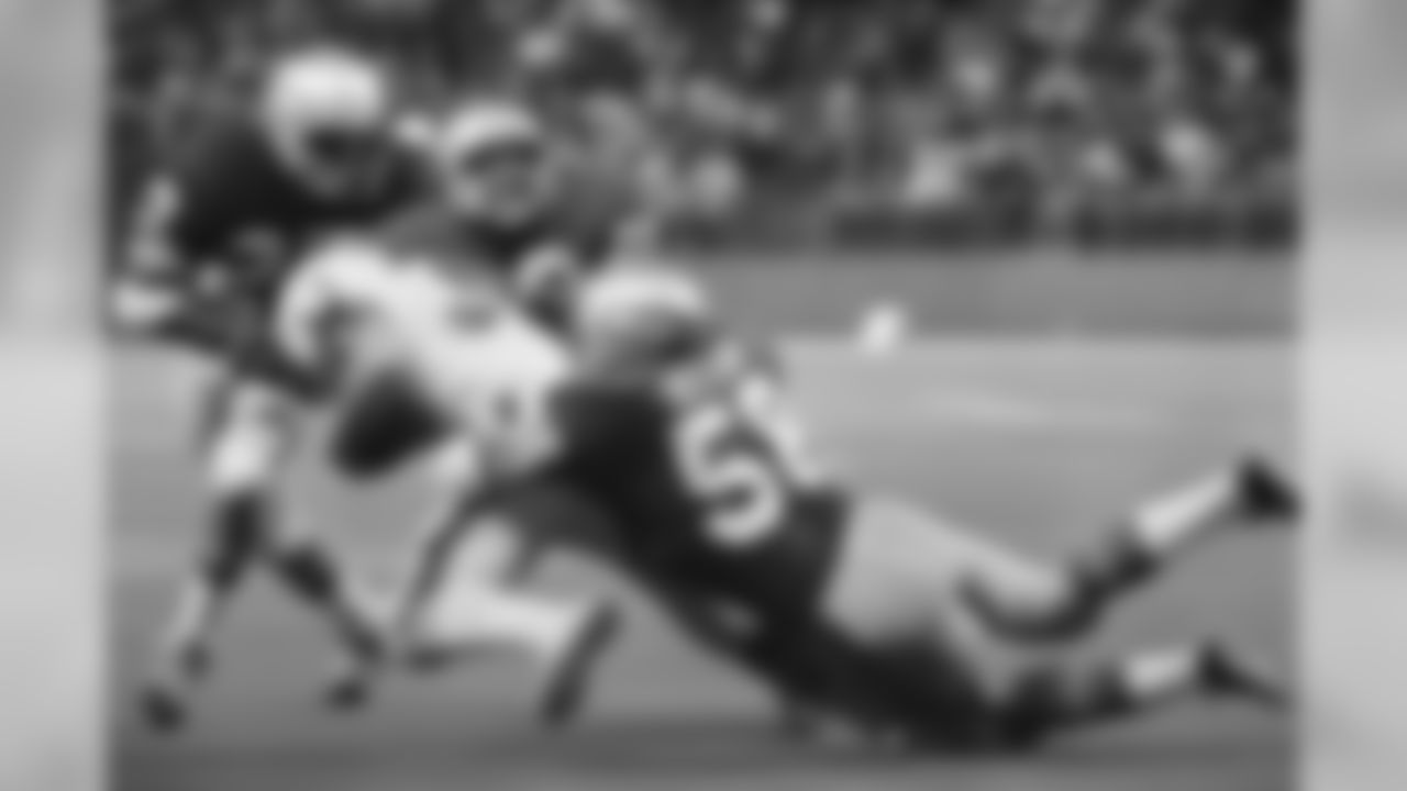 Jim Kiick (33) of the Denver Broncos is brought down by Terry Beeson (58) and Dave Brown (22) of the Seattle Seahawks in the second quarter in Seattle, Wash., Oct. 3, 1977. Denver won 24-13. (AP Photo)