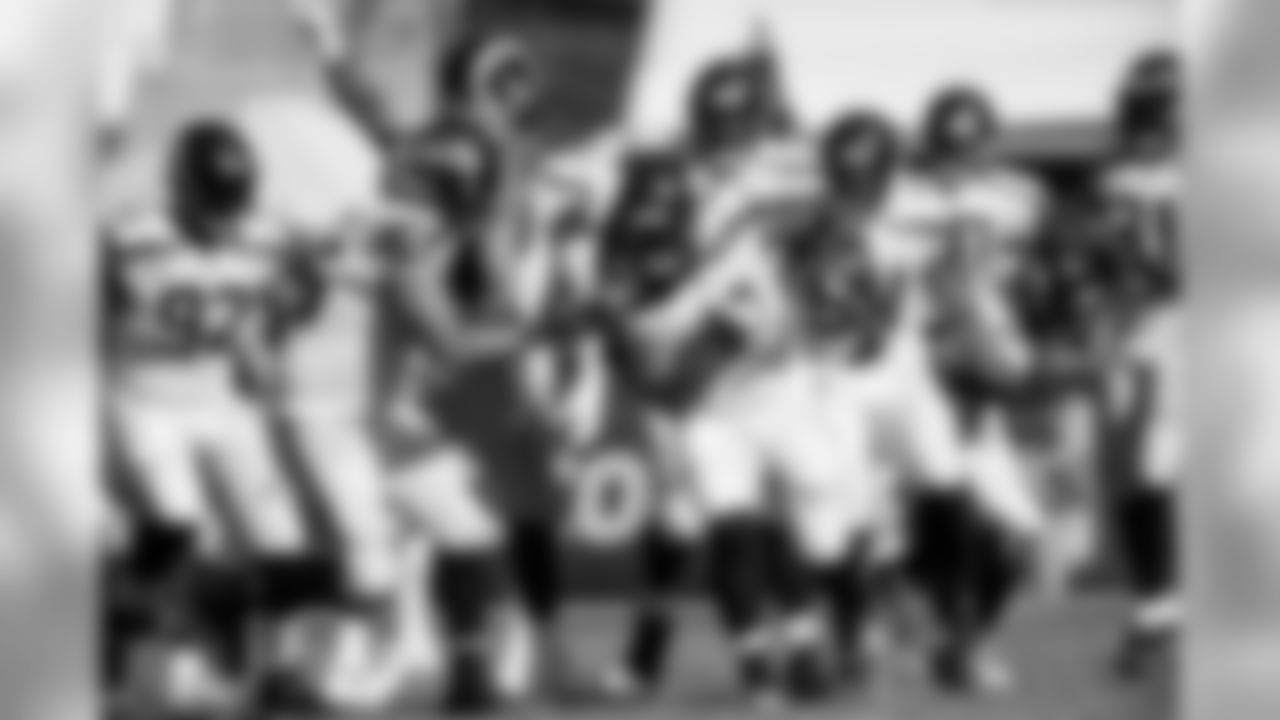 The Seahawks defense celebrates with defensive lineman Sheldon Richardson after his interception.