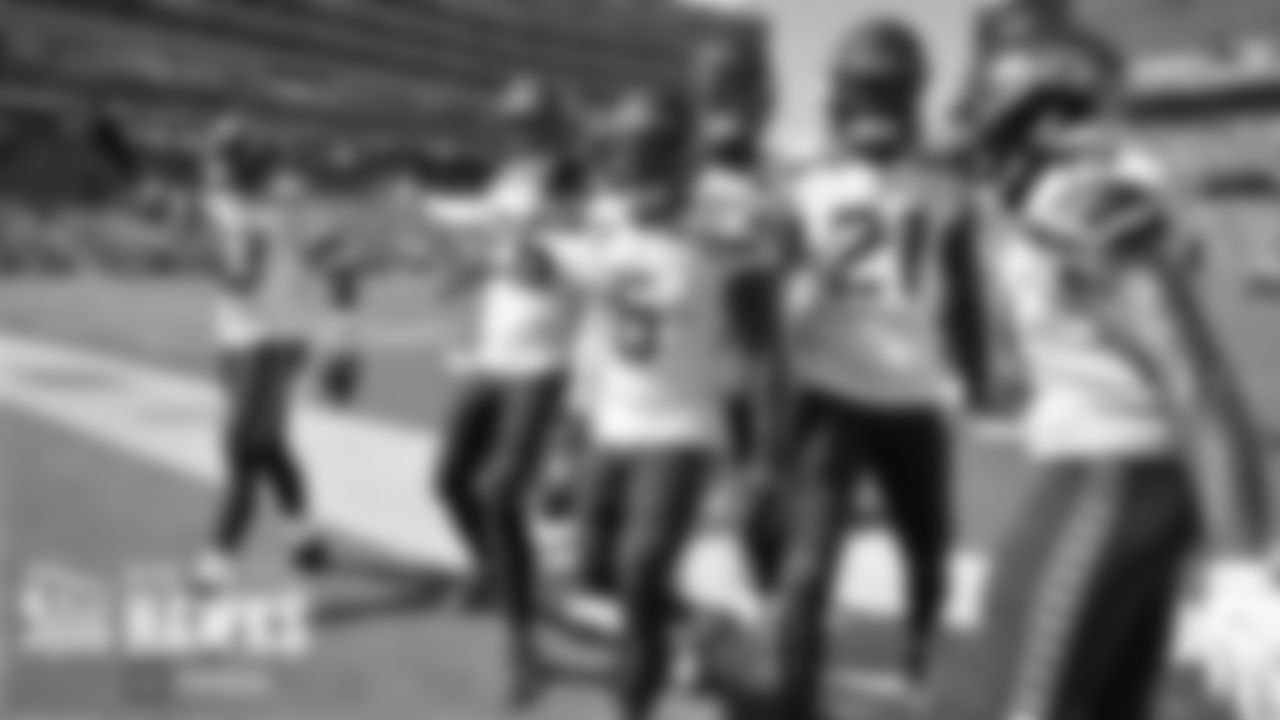 Seahawks players celebrate with Quandre Diggs after his interception. From left are Jamal Adams, Ryan Neal, Diggs, Darrell Taylor, Tre Flowers and Penny Hart.
