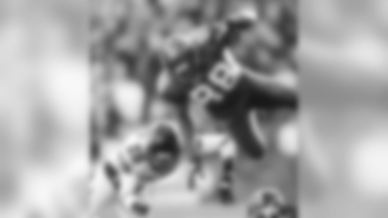 Seattle Seahawks wide receiver Cameron Morrah dives over Falcons defenders on his way down the field during a game on December 19, 2010.