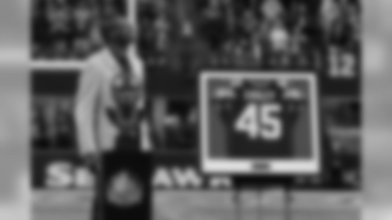Kenny Easley looks towards the east rafters of CenturyLink Field as his jersey was revealed next to the retired numbers of other Seahawks greats Steve Largent, Walter Jones and Cortez Kennedy. The number 12 is also retired in honor of the fans.