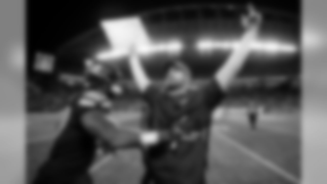 Seattle offensive coordinator Brian Schottenheimer looks up towards the coaches booth at the end of the Seahawks victory over Green Bay on Thursday Night Football.