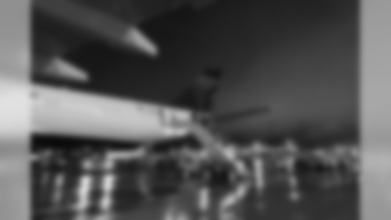 The Seahawks disembark from their Delta charter, home safely at SeaTac airport at 6am Monday after flying all-night across the country, victorious after defeating the New England Patriots.
