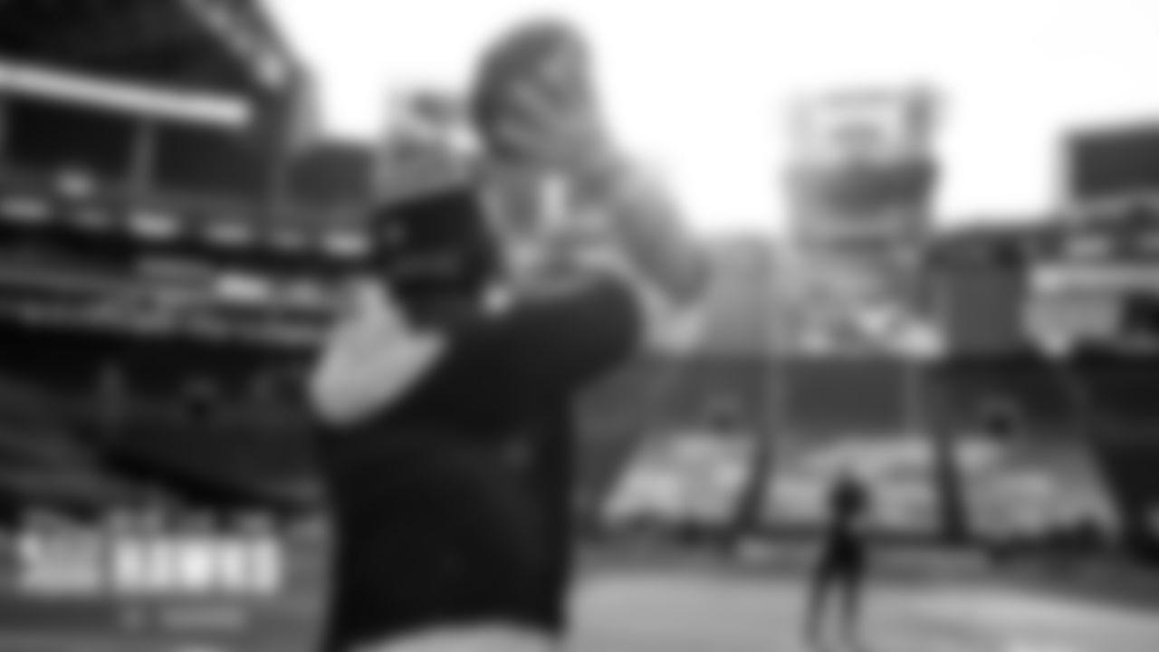 Seahawks quarterback Russell Wilson takes his warm-up throws on a bright January afternoon.