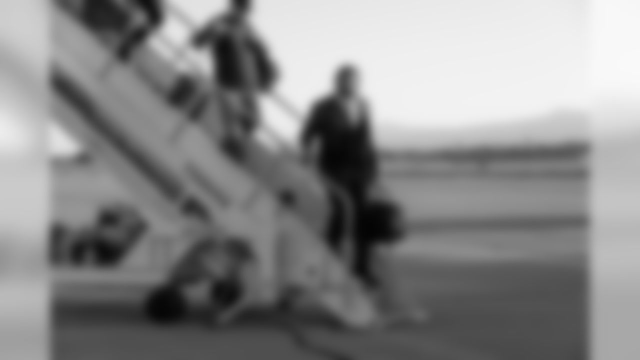 The weather was much milder upon landing in San Jose as Michael Bennett descends the stairs from the aircraft.