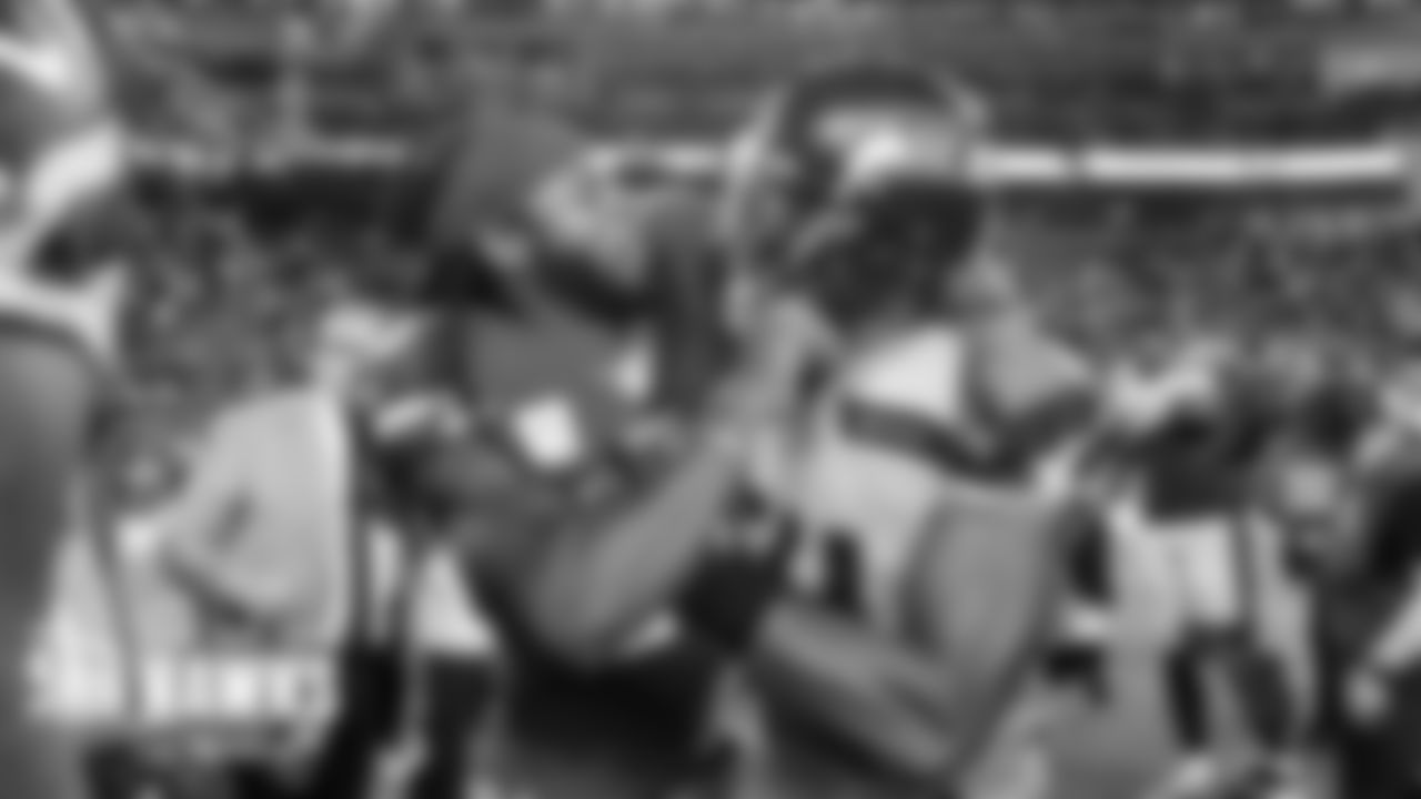 After the game, friends and former teammates Richard Sherman and Bobby Wagner playfully roughhoused as the teams shook hands.