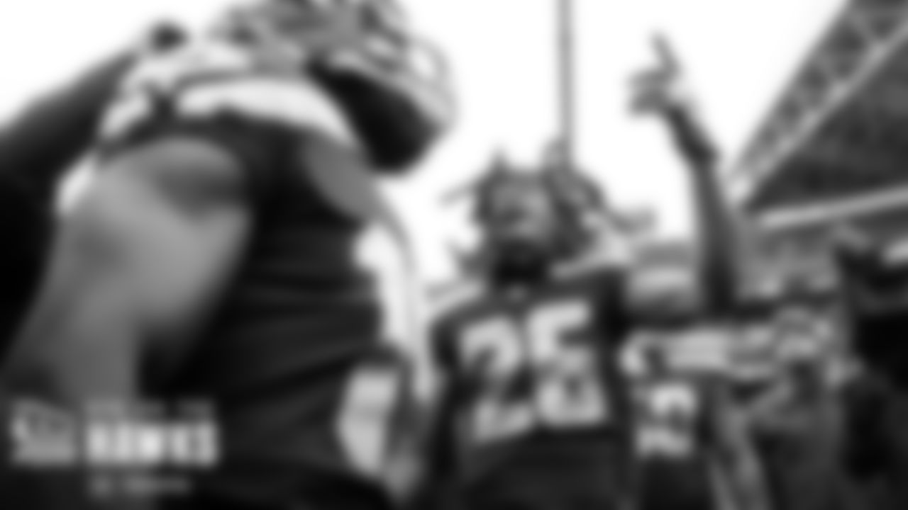 Seahawks safety Ryan Neal gets pumped up in the team huddle before the game.