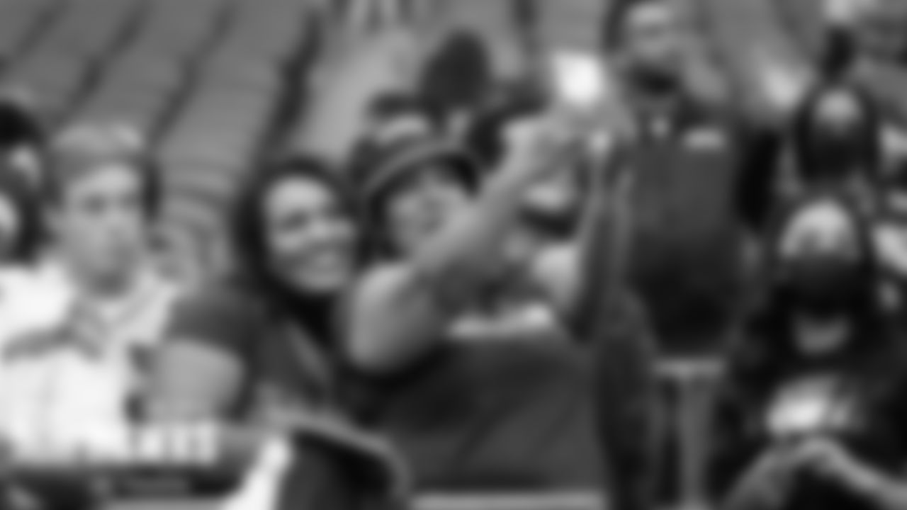 12s snap a selfie while waiitng for the teams to take the field.