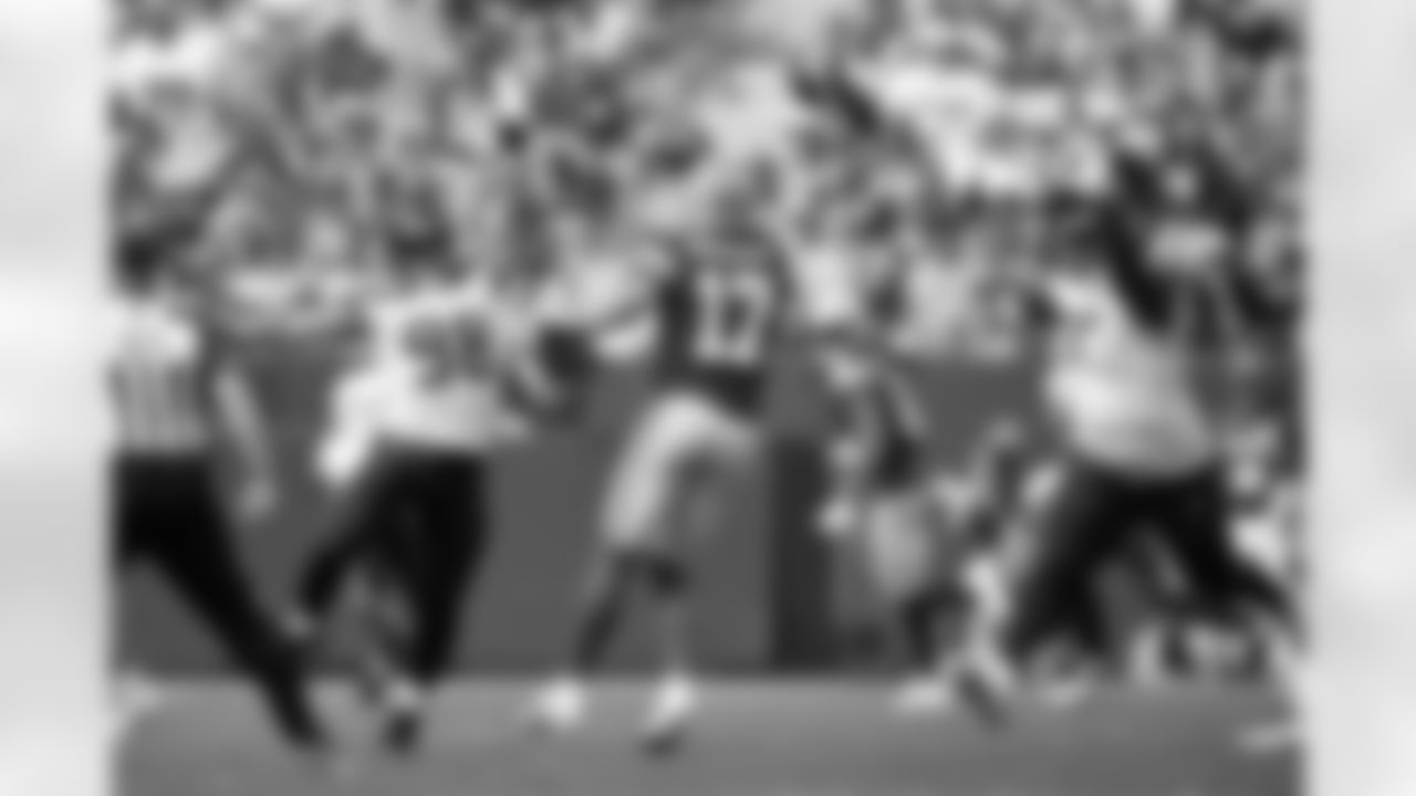 Seahawks Levi Bell and Matt Gotel pressure Packers quarterback Alex McGough.
