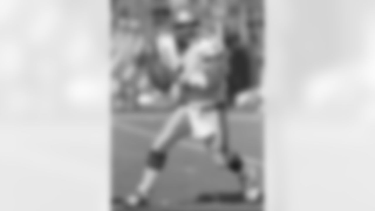 * FILE * Seattle Seahawks quarterback Warren Moon scrambles in the first half before delivering a pass against the San Diego Chargers on Sunday, Nov. 9, 1997, in San Diego. Moon completed 24 of 45 passes for 295 yards and two touchdowns as Seattle won 37-31. (AP Photo/Lenny Ignelzi)