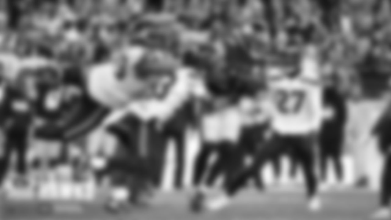 Seahawks Al Woods and Jamal Adams combine to make a tackle in the third quarter.