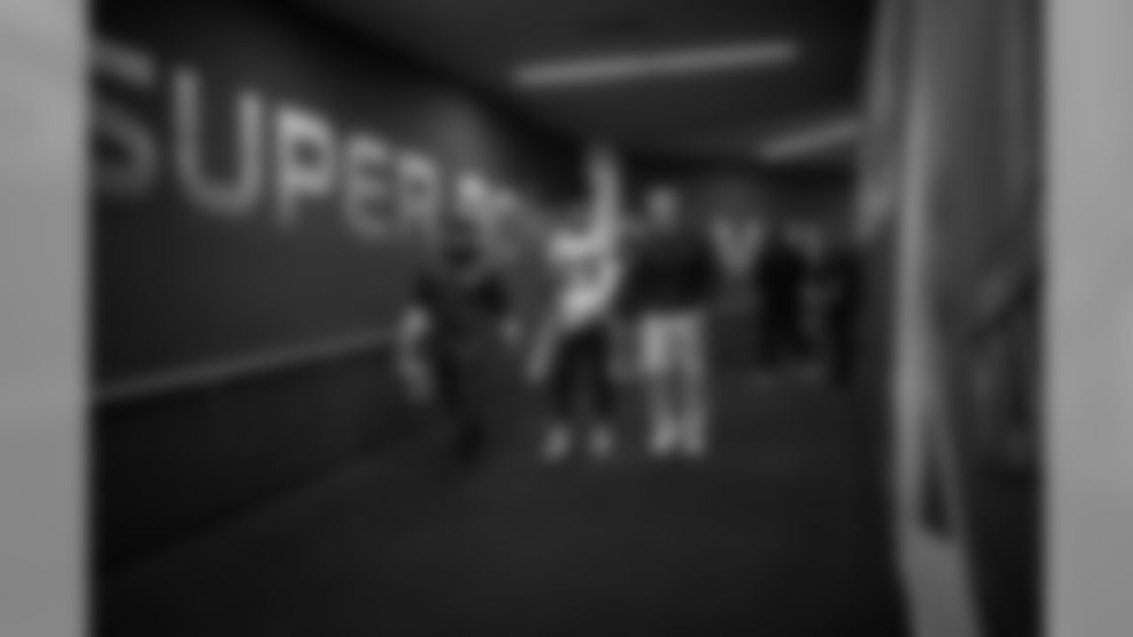 Head coach Pete Carroll and safety Earl Thomas walk down the tunnel from the locker room back to the field after the long halftime intermission.