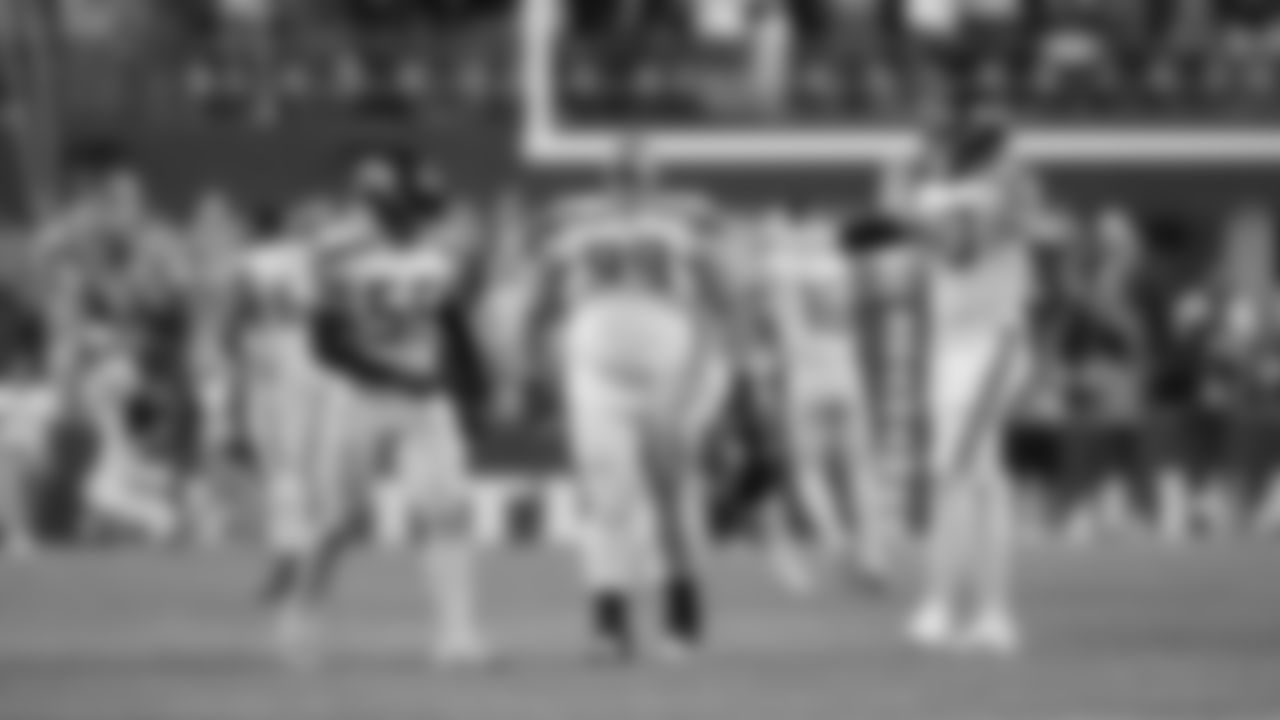 Seahawks Jordyn Brooks, Al Woods and Darryl Johnson celebrate after a missed field goal by Denver in the final minute.