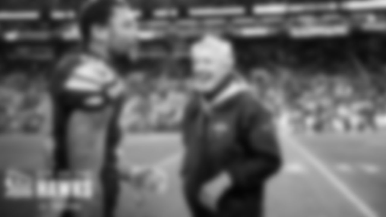 Seahawks head coach Pete Carroll and receiver Freddie Swain are all smiles on the sidelines near the end of the game.