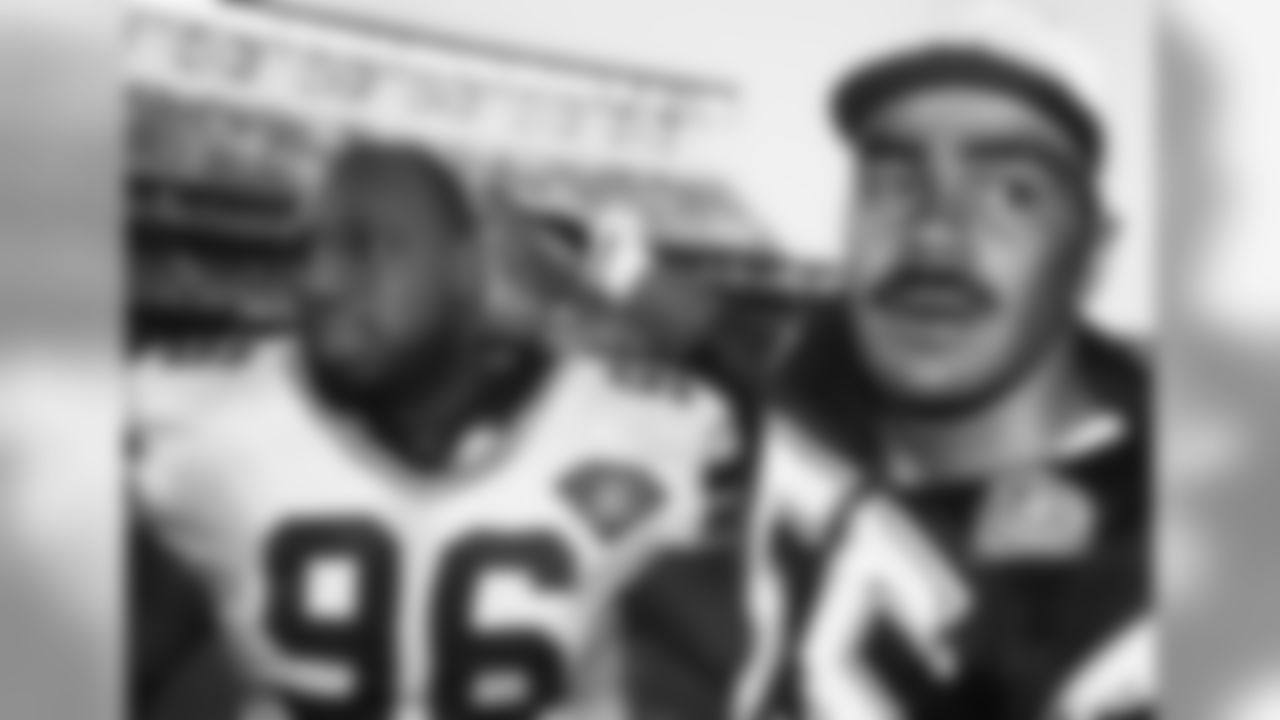 Seattle Seahawks nose tackle Cortez Kennedy (96) leaves the field after play with San Diego Chargers linebacker Junior Seau (55) in San Diego in 1994. (AP Photo / Al Messerschmidt)