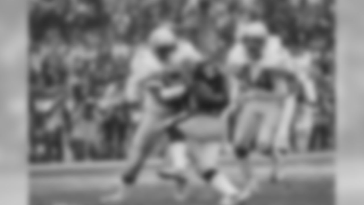 Los Angeles Raiders veteran running back Frank Hawkins (27) pushes his way across the goal line for his second touchdown of the day despite the defensive efforts of Seattle Seahawks Kenny Easley during first half action at the Coliseum on Sunday, Jan. 8, 1984 in Los Angeles. (AP Photo)