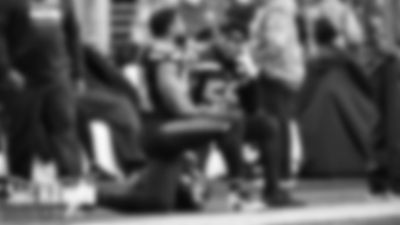 Seahawks linebackers Jordyn Brooks and Bobby Wagner talk on the sideline near the end of the game.
