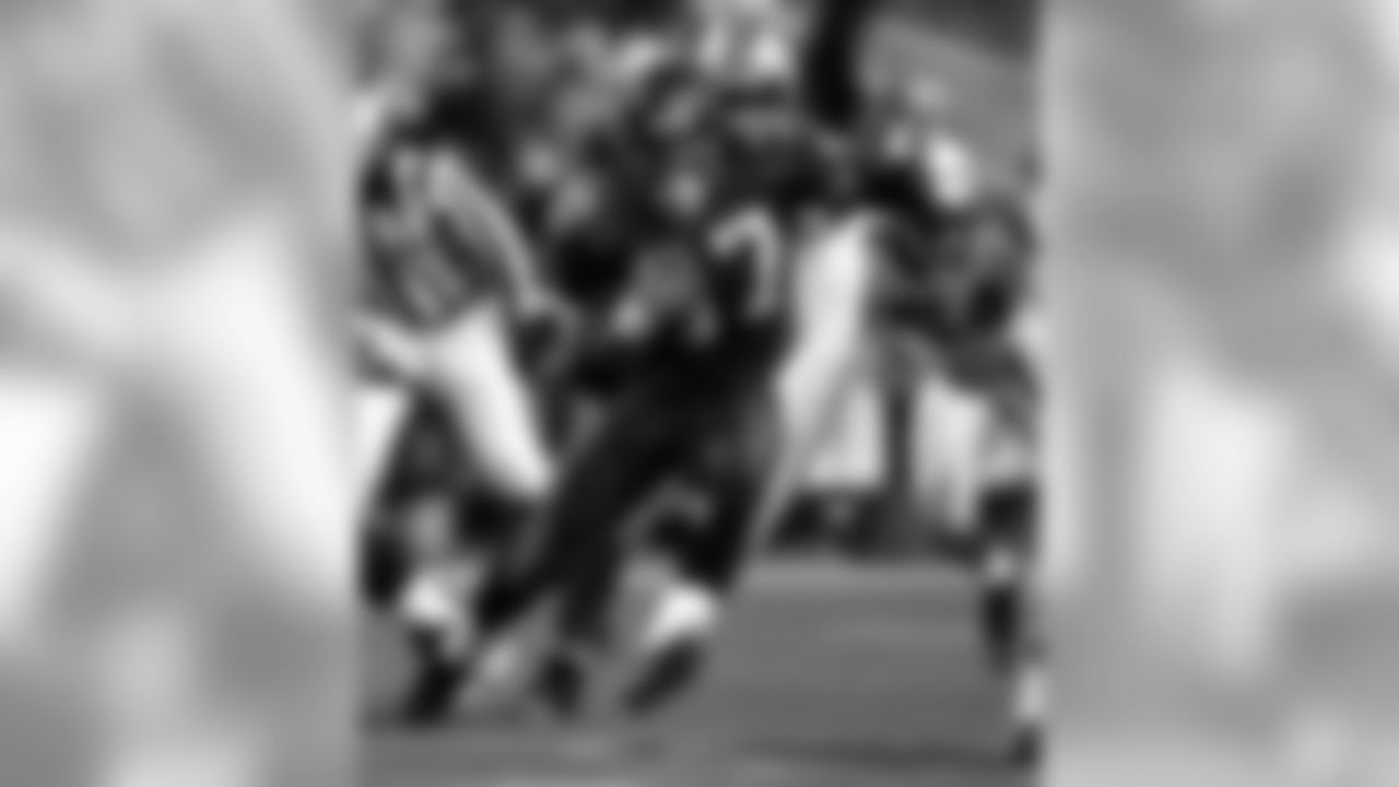 Seattle Seahawks Shaun Alexander (37) carries the ball under the pressure of the Carolina Panthers during the second quarter of the their NFC Championship NFL football game in Seattle, in a Sunday, Jan. 22, 2006 photo. He's the league MVP. The league rushing champion. He's also playing the last game of his Seattle contract, making him potentially the biggest plum in March's free-agent tree. (AP Photo/Rick Bowmer, file)