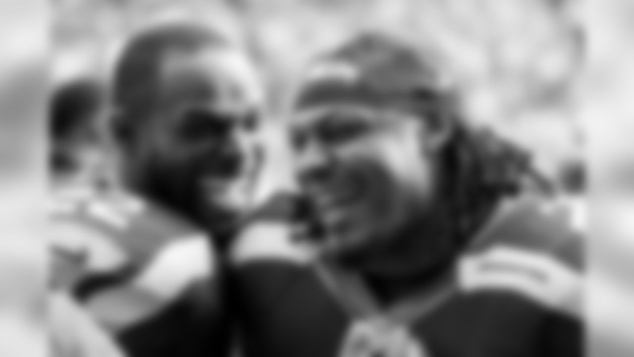 Running backs Robert Turbin and Marshawn Lynch stay loose before kickoff.