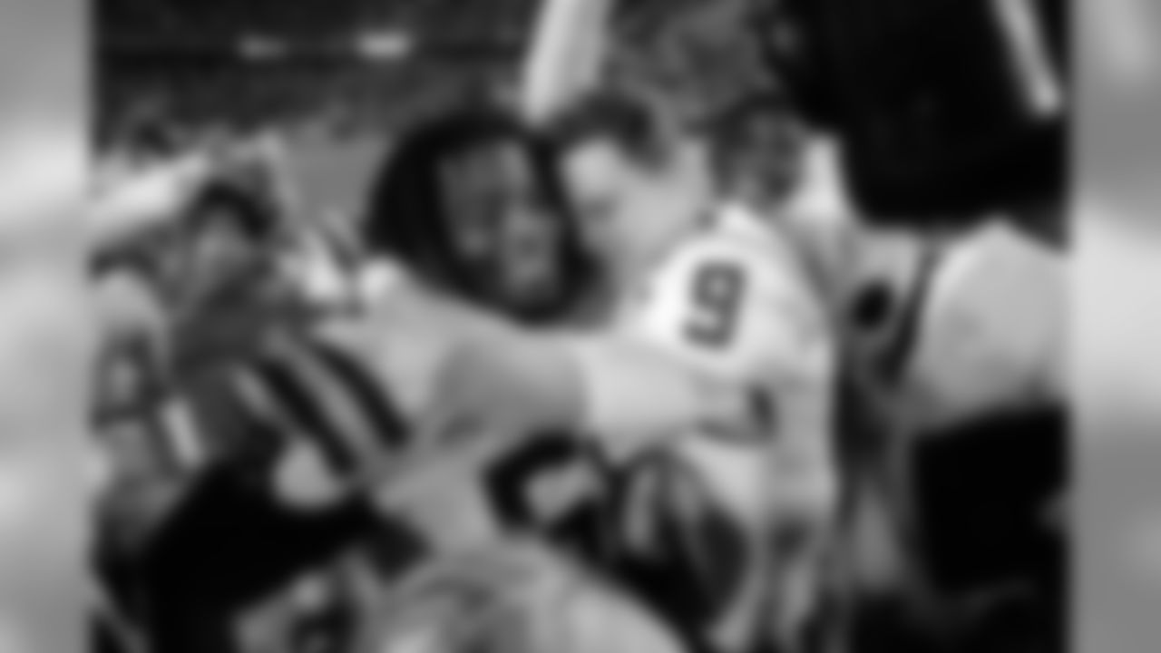 LSU quarterback Joe Burrow (9) hugs guard Damien Lewis after the team's NCAA college football game against Texas A&M in Baton Rouge, La., Saturday, Nov. 30, 2019. LSU won 50-7. (AP Photo/Gerald Herbert)