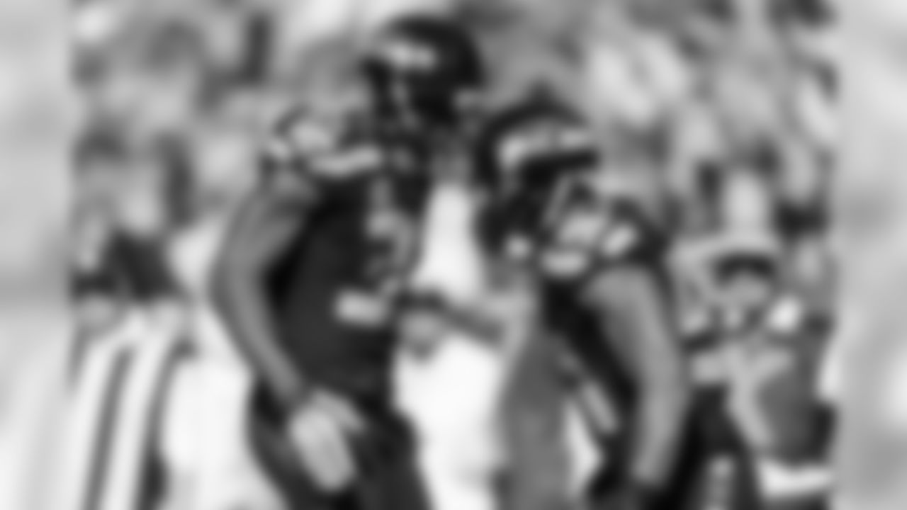 Cornerback DeShawn Shead congratulates linebacker Bobby Wagner after Wagner's interception in the third quarter.