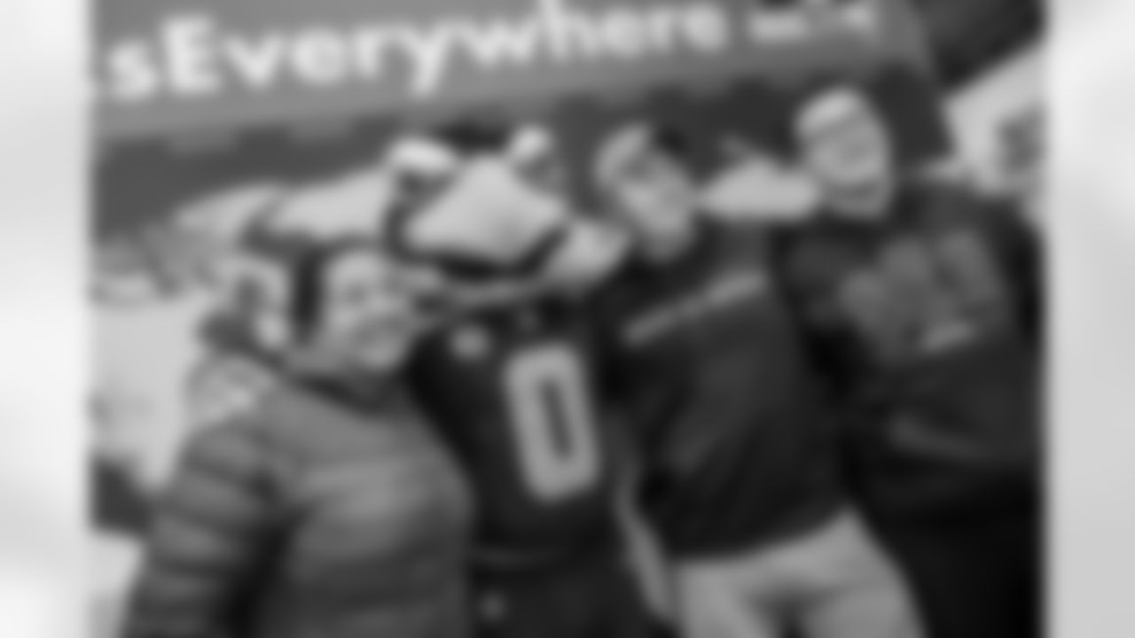 Seahawks' mascot, Blitz poses for a photo with fans during the Seattle Seahawks Pub Event at the Augustiner Stammhaus pub, on Friday, Nov. 11 2022 in Munich. (AP Photo/Omer Messinger)