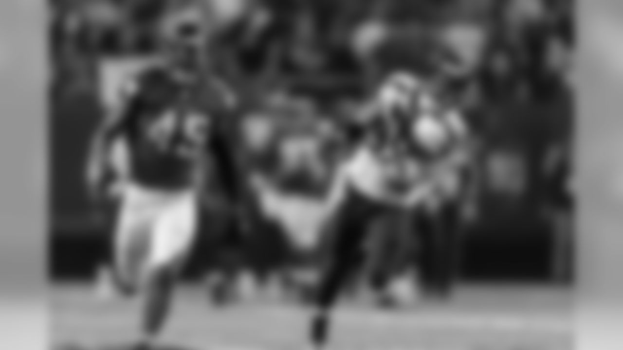 Seattle's Doug Baldwin lunges but can't quite get to a long pass thrown by quarterback Russell Wilson.