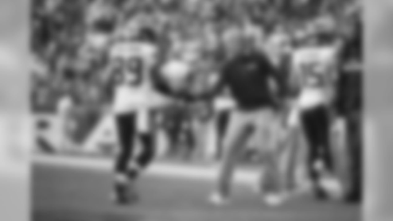 Head coach Pete Carroll congratulates receiver Doug Baldwin after the first of Baldwin's three touchdowns on the day.