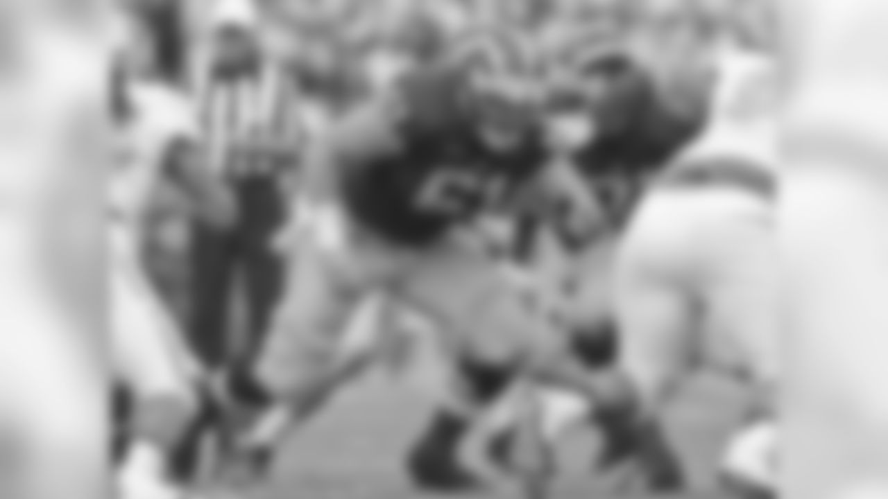 Michigan offensive lineman Graham Glasgow (61) blocks in position in the first quarter of an NCAA college football game against UNLV in Ann Arbor, Mich., Saturday, Sept. 19, 2015. (AP Photo/Tony Ding)