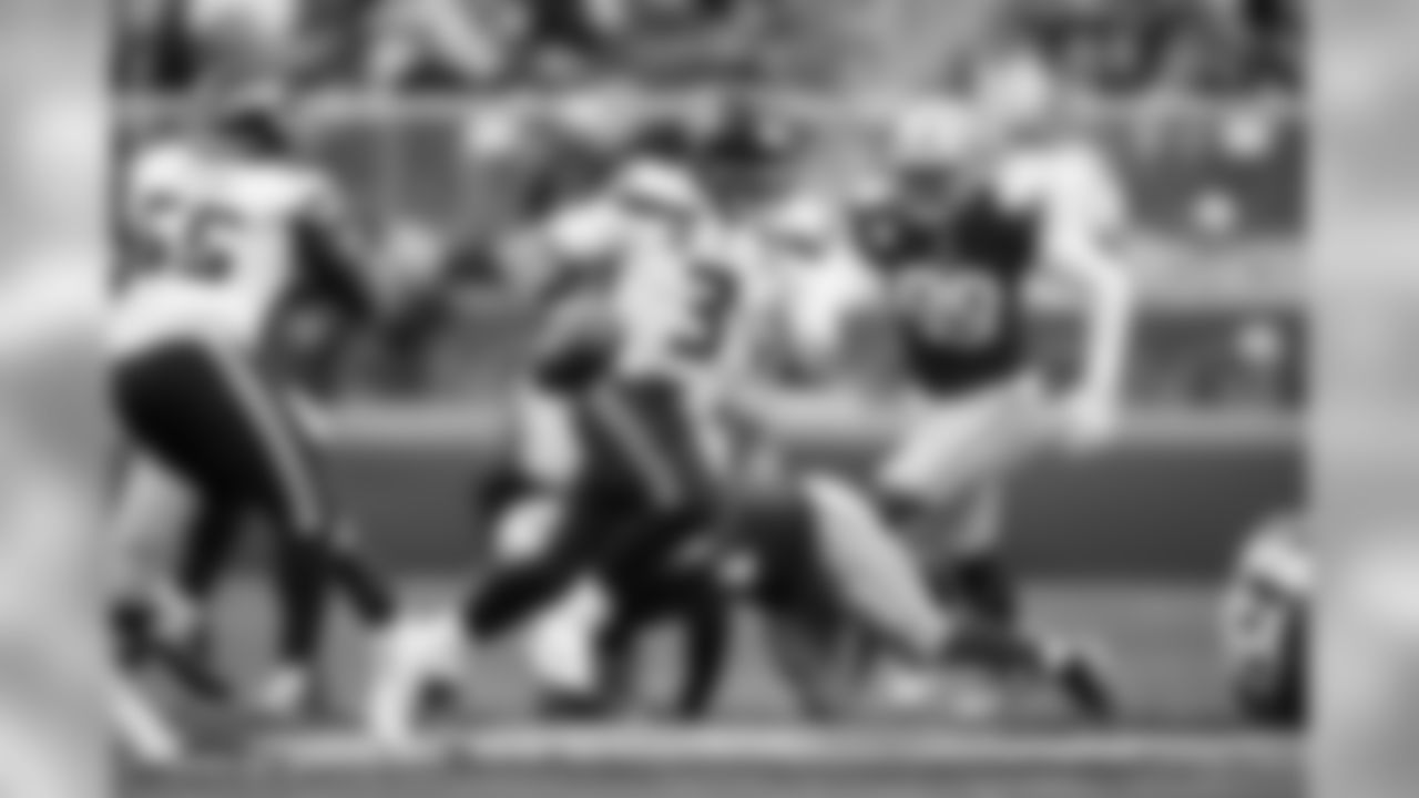 Seahawks quarterback Russell Wilson scrambles out of the pocket.