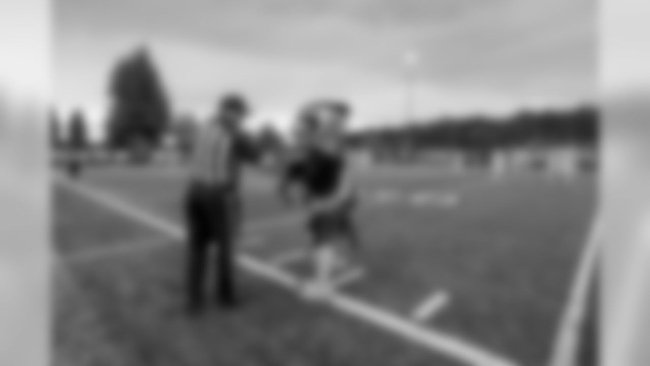 Blitz greets members of the officiating team ahead of the September 23 Blue Friday Night Lights game at Mt. Si High School.
