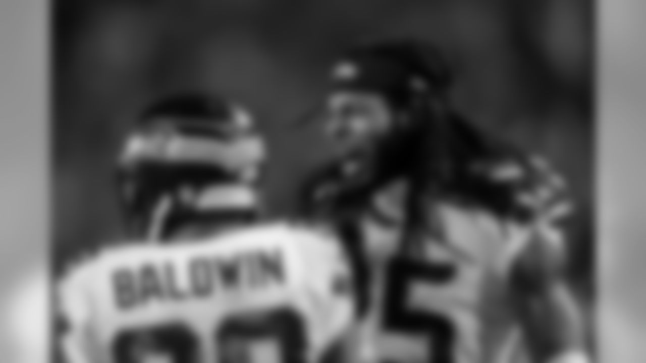 Richard Sherman raced down the sideline to celebrate with Baldwin after the long catch.