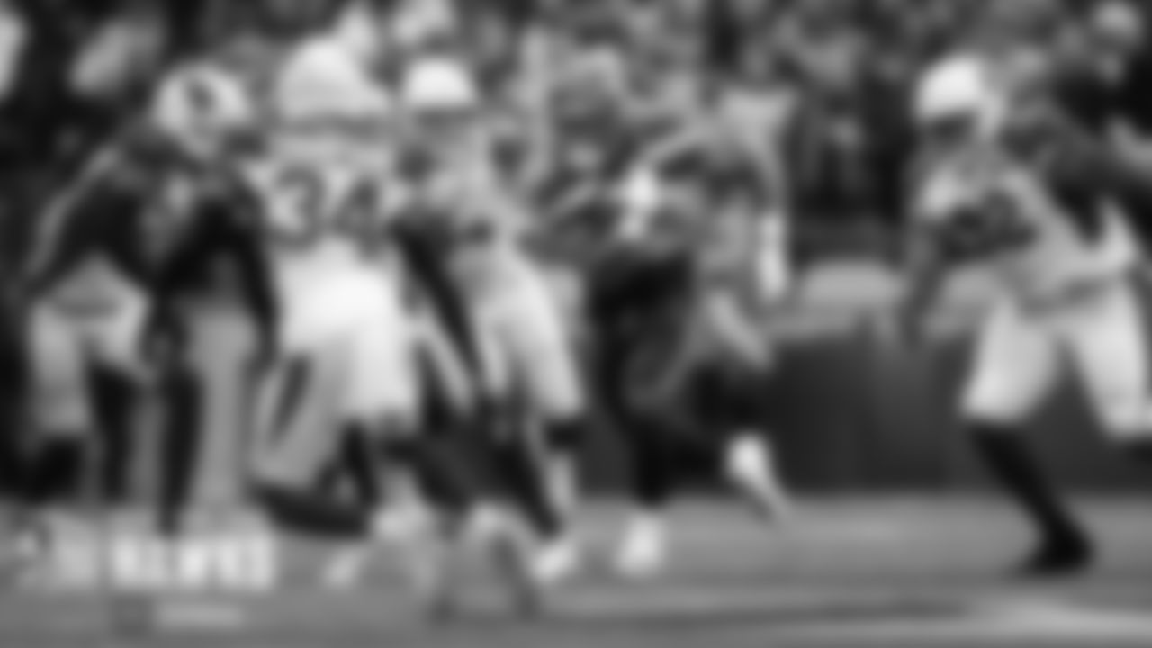 Seahawks running back Chris Carson darts through an opening on the team's opening drive of the game.