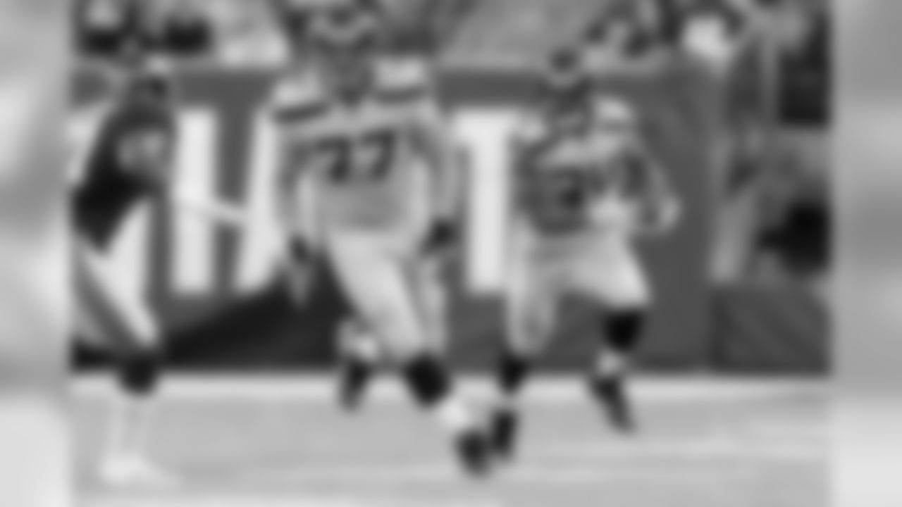 Offensive guard Ethan Pocic, getting his first NFL start, leads the way for running back Thomas Rawls.