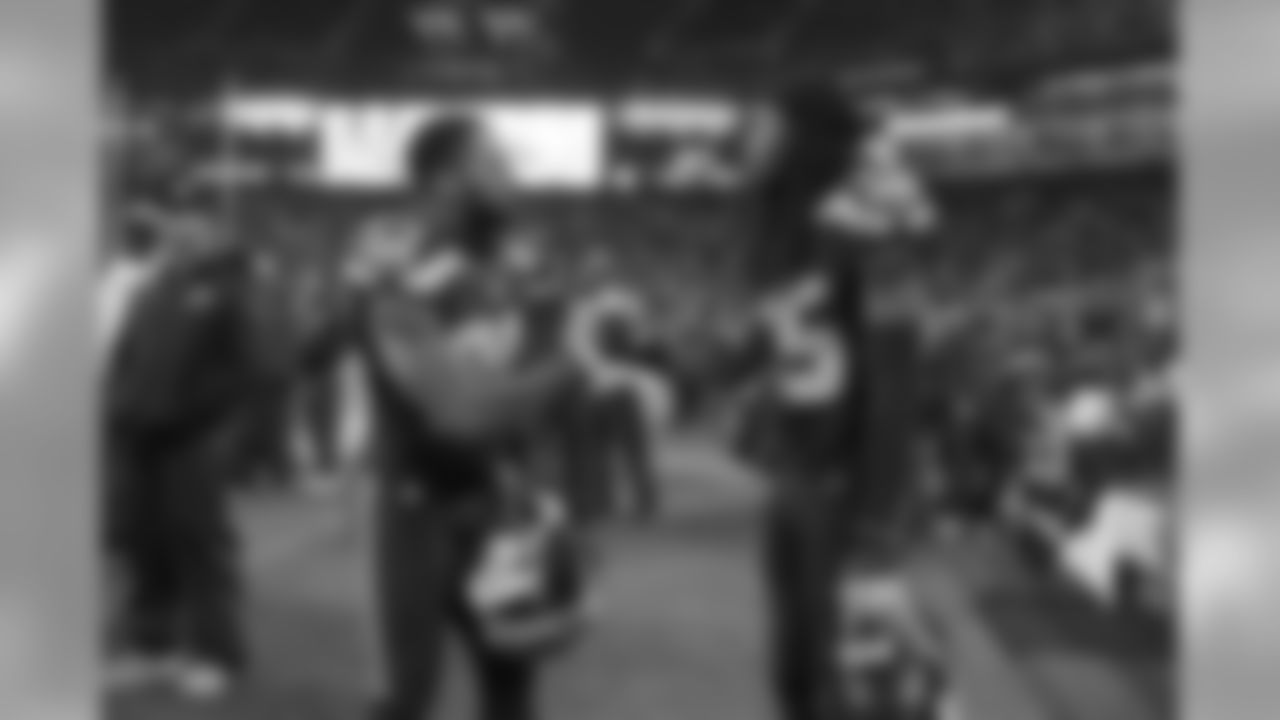 Defensive backs Earl Thomas and Richard Sherman shake hands on the sidelines as the clock runs out on Seattle's 39-30 win over the visiting Pittsburgh Steelers.