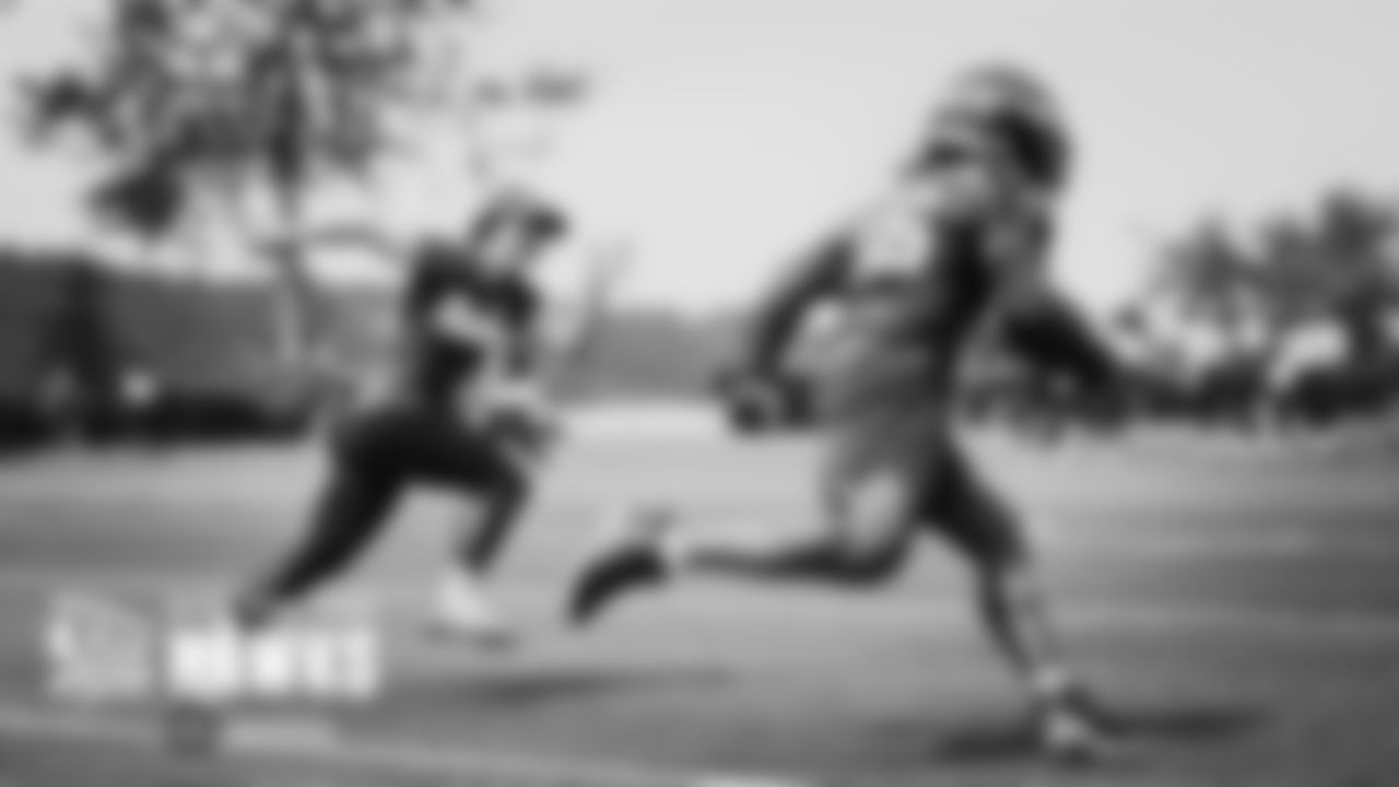Amanda Ruller, one of three recipients of the NFL's Bill Walsh Diversity Coaching Fellowship is working with the running backs and chases down Darwin Thompson during a drill.
