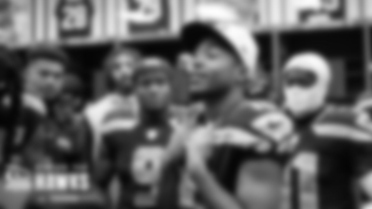 Seahawks offensive captain Tyler Lockett talks to the team before the take the field.