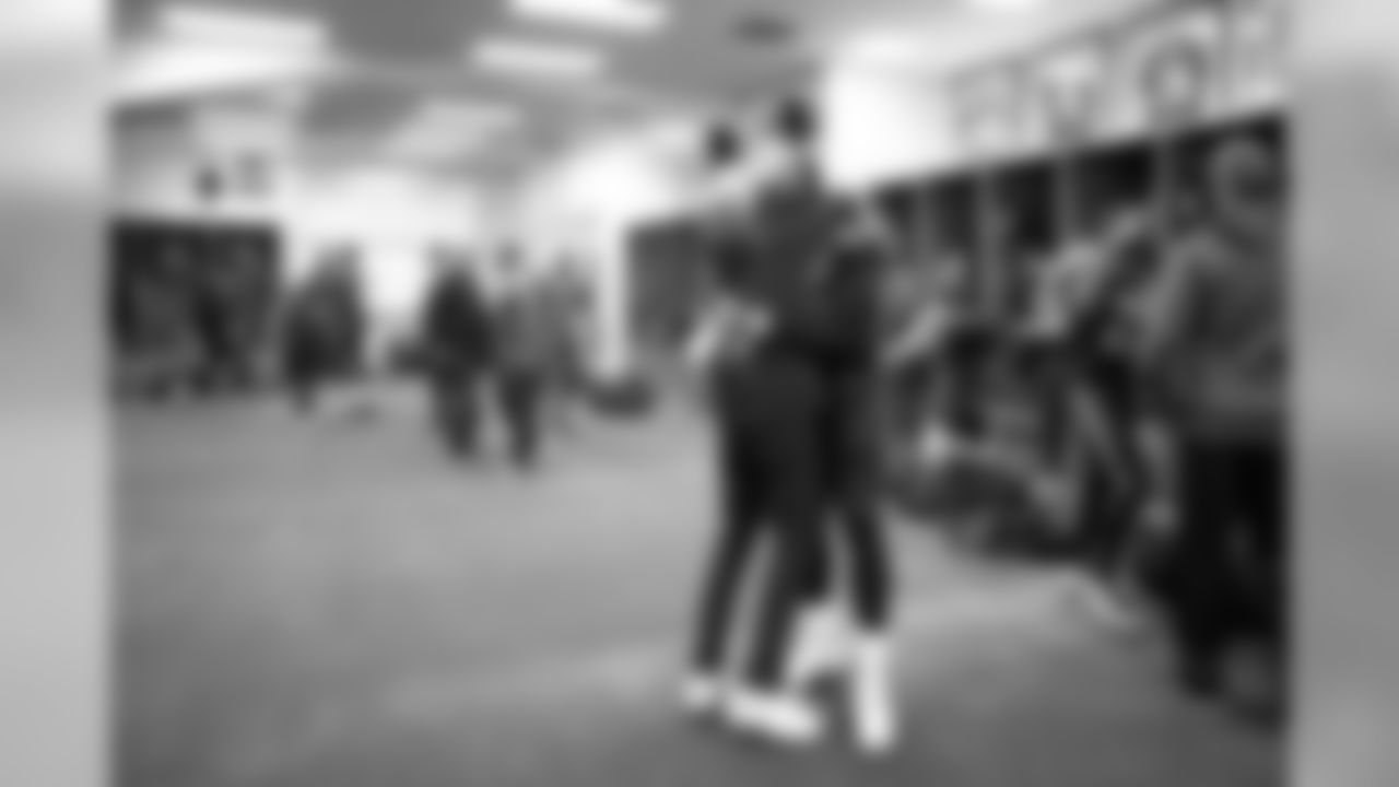 In the Seahawks locker room head coach Pete Carroll hugged defensive end Frank Clark.