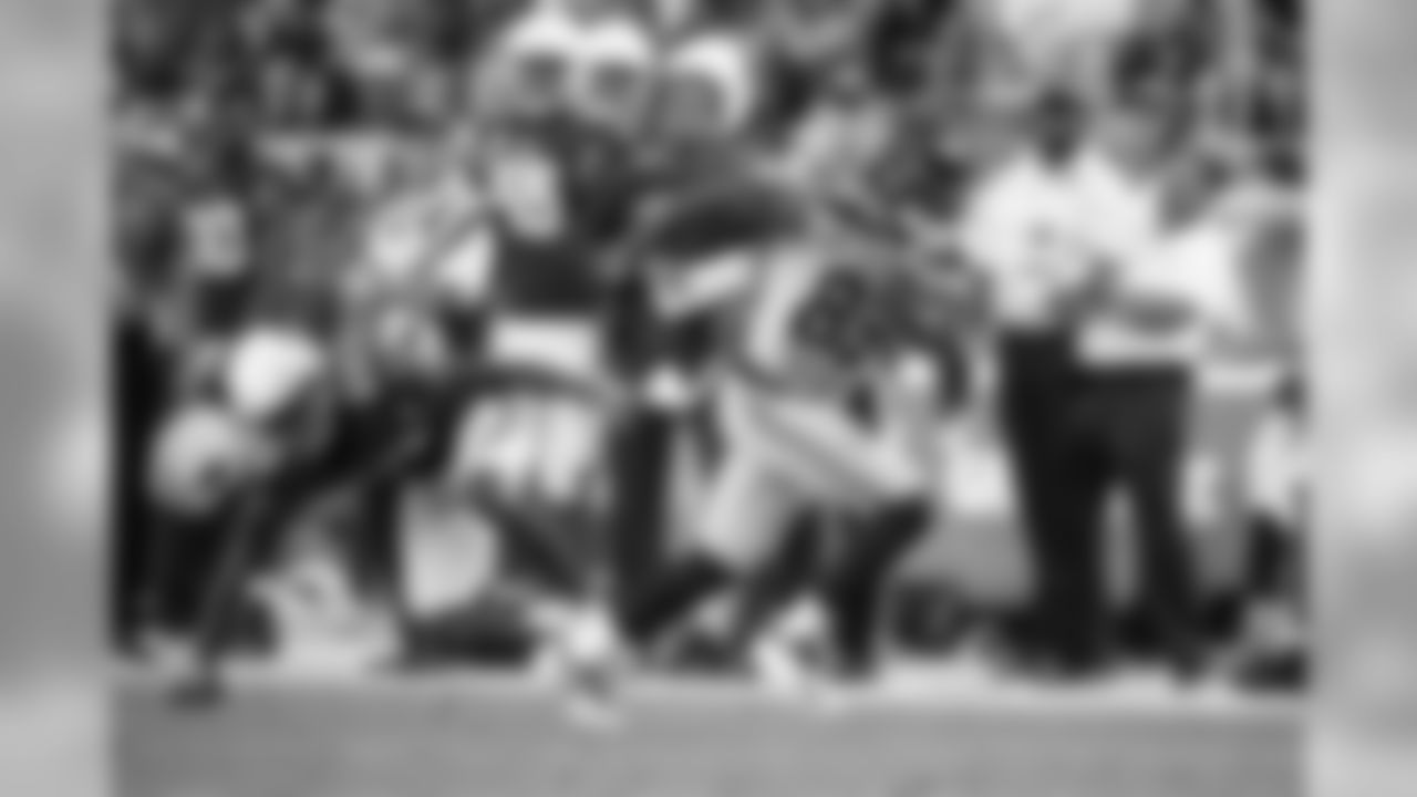 Seattle receiver David Moore breaks a tackle and heads down the sideline in the third quarter.