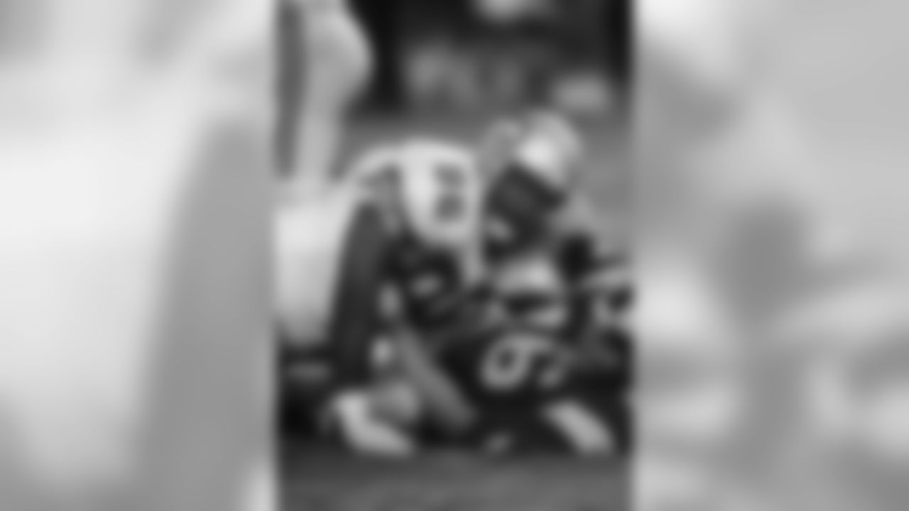 Seattle Seahawks defensive tackle Cortez Kennedy (96) topples a St. Louts Rams quarterback (16) during a pre-season NFL football game in 1991. (Al Messerschmidt via AP)