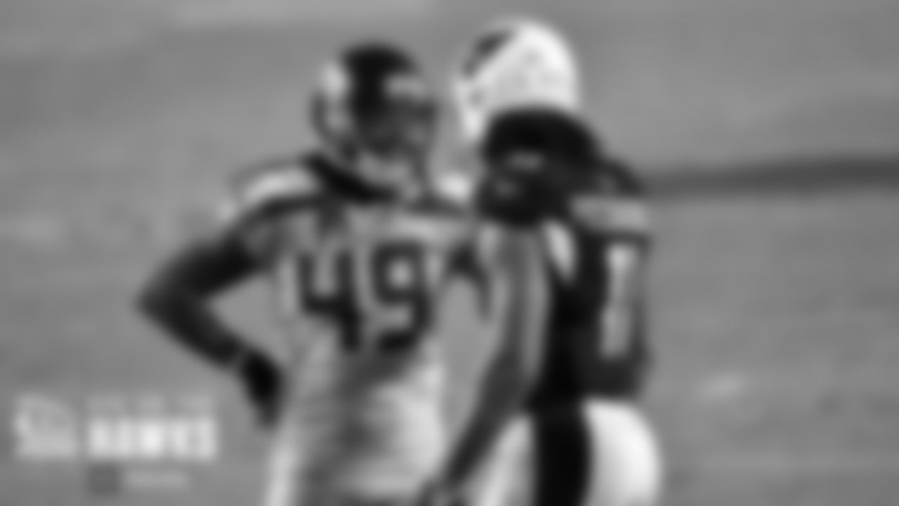 Arizona Cardinals wide receiver Larry Fitzgerald (11) talks with Seattle Seahawks outside linebacker Shaquem Griffin (49) during an NFL football game against the Seattle Seahawks on Sunday, October 25, 2020 in Glendale, Arizona. (Alika Jenner/NFL)