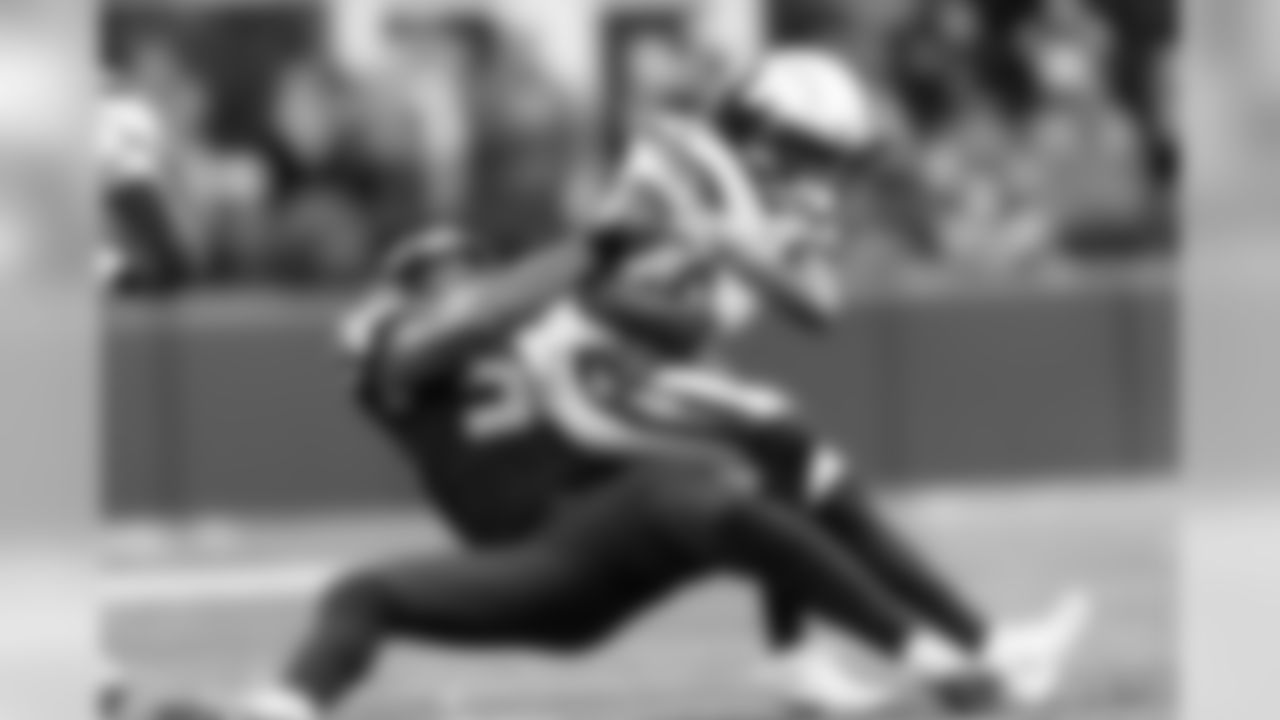 Seattle's K.J. Wright drags down Chargers wide receiver Travis Benjamin.