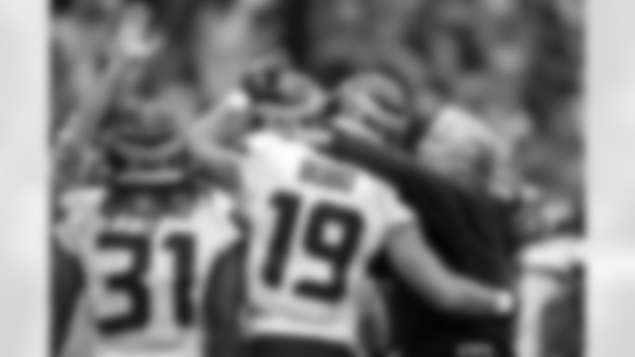 Head coach Pete Carroll congratulates receiver Jake Bobo on his first NFL touchdown in the fourth quarter.