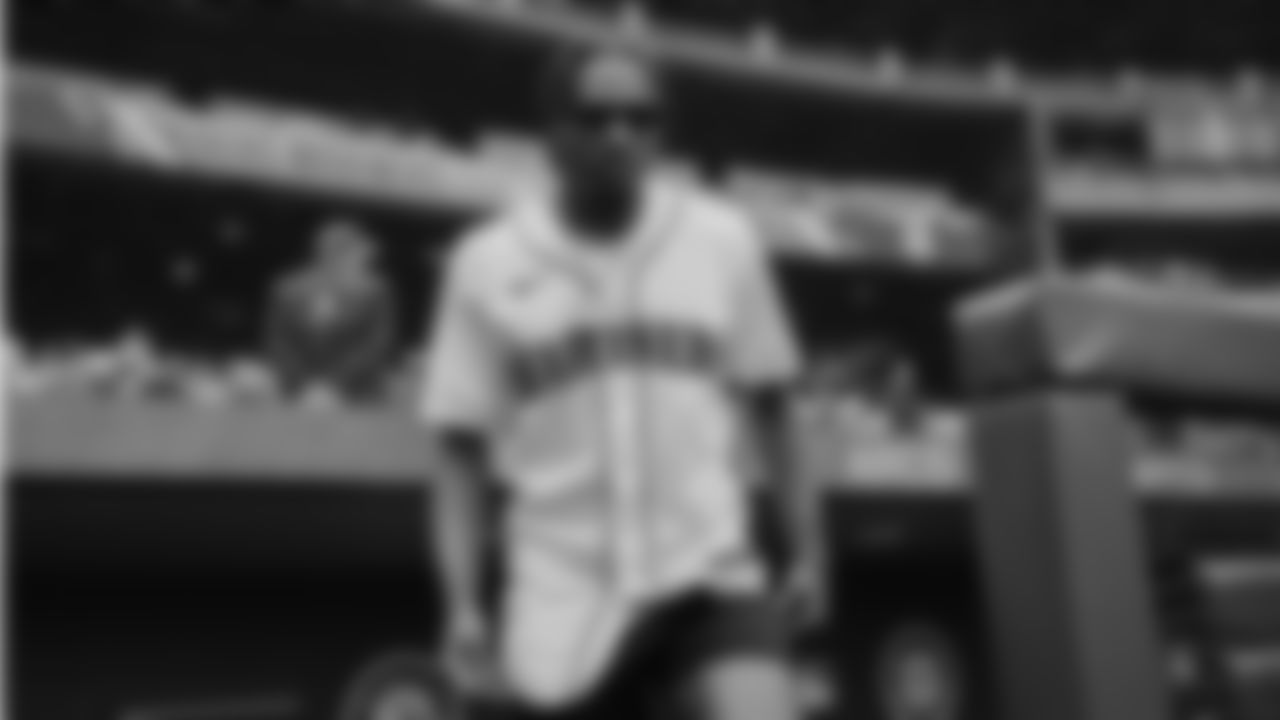 Seahawks cornerback Tariq Woolen throws out the ceremonial first pitch prior to a Mariners game at T-Mobile Park on April 23, 2023.